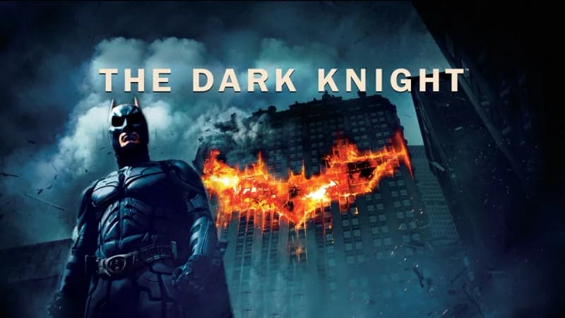 The Dark Knight key art with the burning bat symbol
