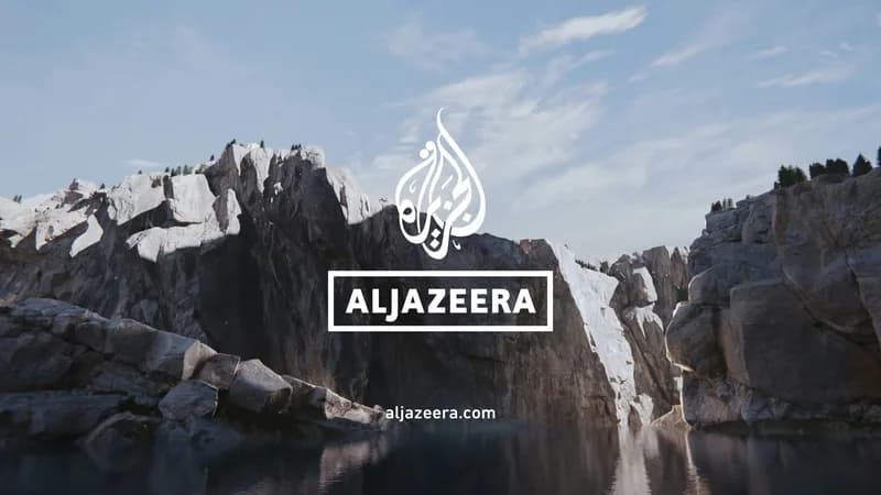 Al Jazeera brand art over a mountain landscape